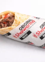 Custom printed greaseproof paper wrapping a shawarma sandwich – custom printed packaging by Texas Food Pack