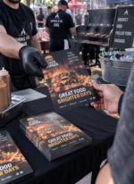 Custom printed menu booklets handed out at a restaurant counter – custom printed packaging and branding by Texas Food Pack