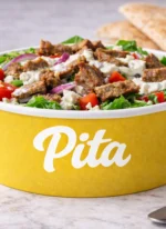 Custom printed yellow round paper bowl with salad – custom printed packaging by Texas Food Pack