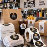 Custom printed sticker labels on takeout bags and roll labels on a counter – custom printed packaging and branding by Texas Food Pack