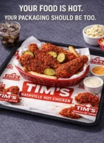 Custom printed tray liner under a fried chicken meal – custom printed packaging by Texas Food Pack